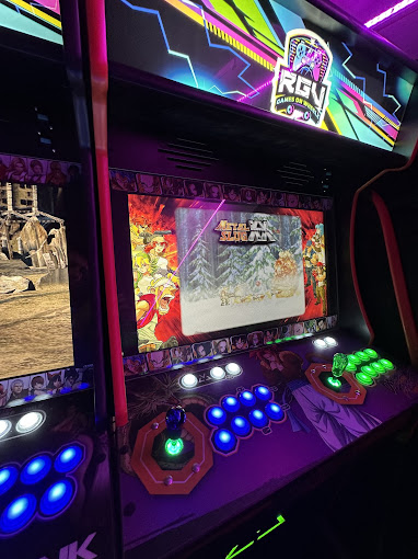 A custom arcade cabinet running a classic fighting game on board the RGV Games on Wheelz bus